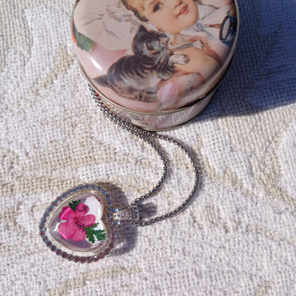 One of a Kind, Handmade Pendant using dried flowers under acrylic cabochon dome. This Pendant is two sided and is like two necklaces in one.