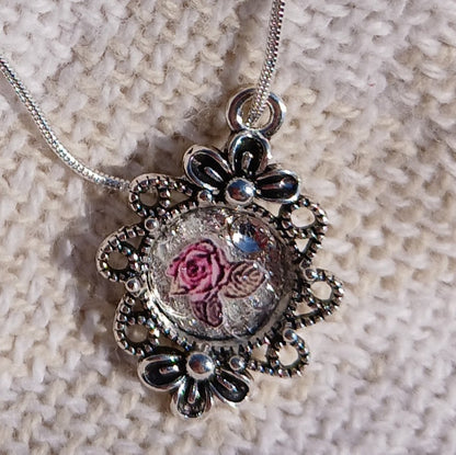 Beautiful Antique look necklaces.  Small and dainty necklaces, feminine flowers under the acrylic cabochan or resin.