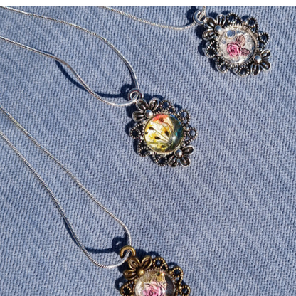 Beautiful Antique look necklaces.  Small and dainty necklaces, feminine flowers under the acrylic cabochan or resin.